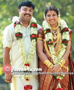 Bipin Divya Wedding Photos at Kanjirappally St Dominics College Auditorium